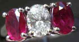 SOLD....Three Stone Diamond and Ruby Ring: Blood red side stones flank really WELL cut Diamond R2188 