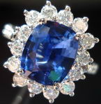 SOLD.....Sapphire and Diamond Halo Ring: 2.32 Lapis Lazuli Blue Cushion Sapphire surrounded by white round diamonds R2500