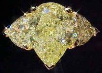 SOLD....Three Stone Diamond Ring: GIA 2.84ct Pear Intense Yellow Diamond R1795