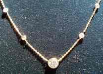 SOLD...Diamond necklace: .49ct Round Billiant Center Diamond by the yard R2490